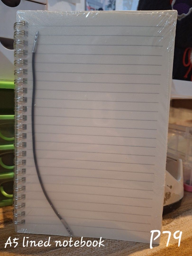 Lined Sprial A5 Notebook Clear Aesthetic Minimal New (Category: Stationery & School Supplies) located in Caloocan City. Submitted by sofiiiqq (Listing ID 1297300060, Image 1). Description: Sealed and Brand New.