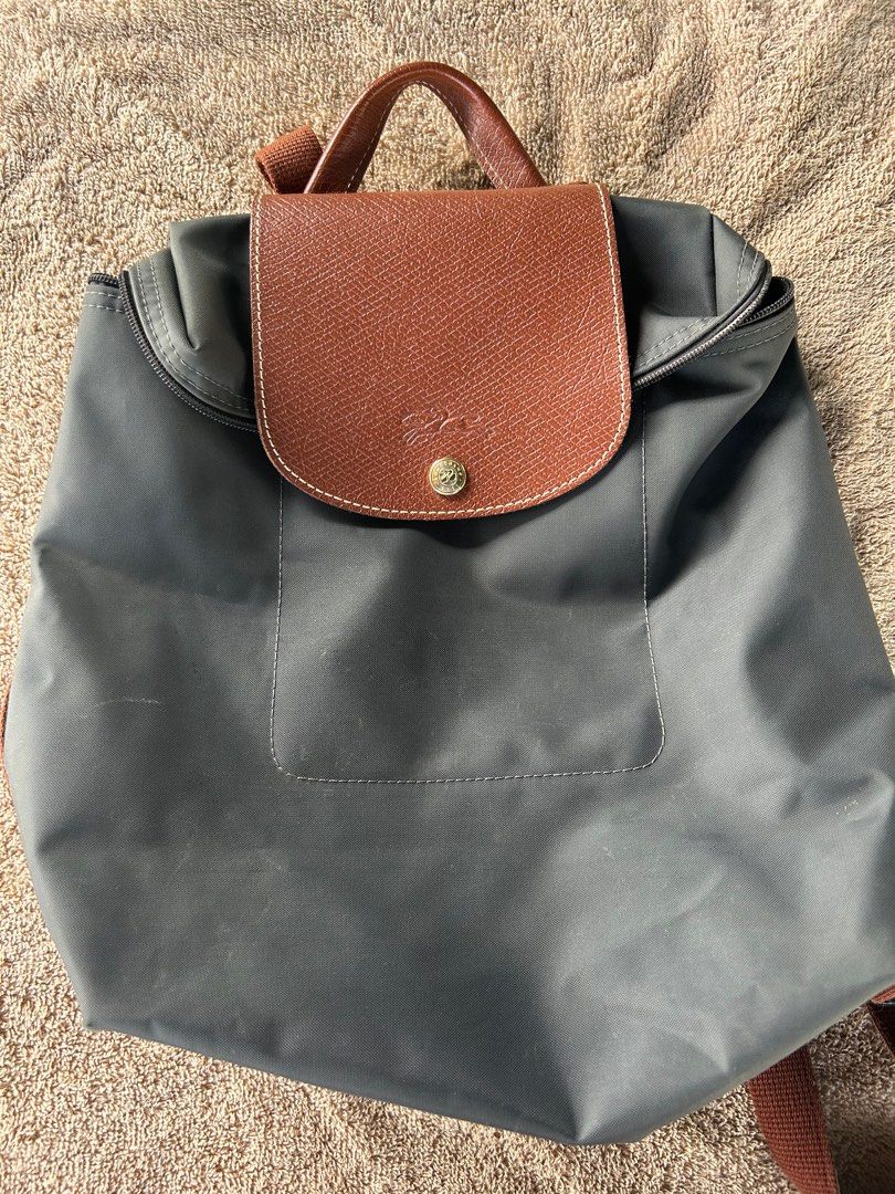 LONGCHAMP preloved (Category: Backpacks) located in Malabon City. Submitted by everythinggoeson (Listing ID 1297294783, Image 1). Description: authentic lc with zipper flaw.