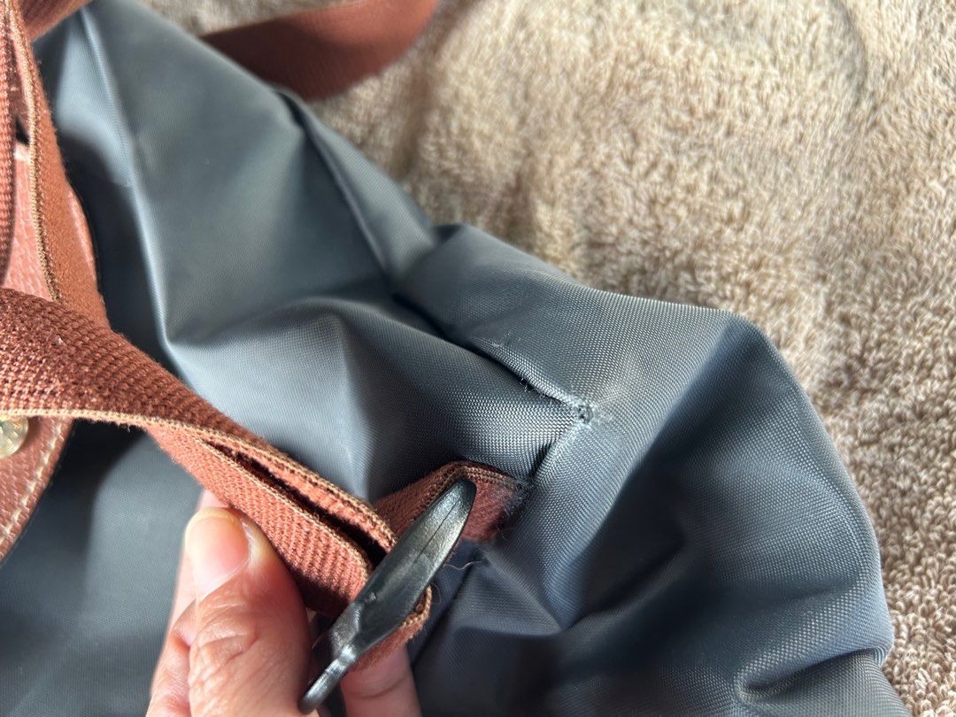 LONGCHAMP preloved (Category: Backpacks) located in Malabon City. Submitted by everythinggoeson (Listing ID 1297294783, Image 3). Description: authentic lc with zipper flaw.