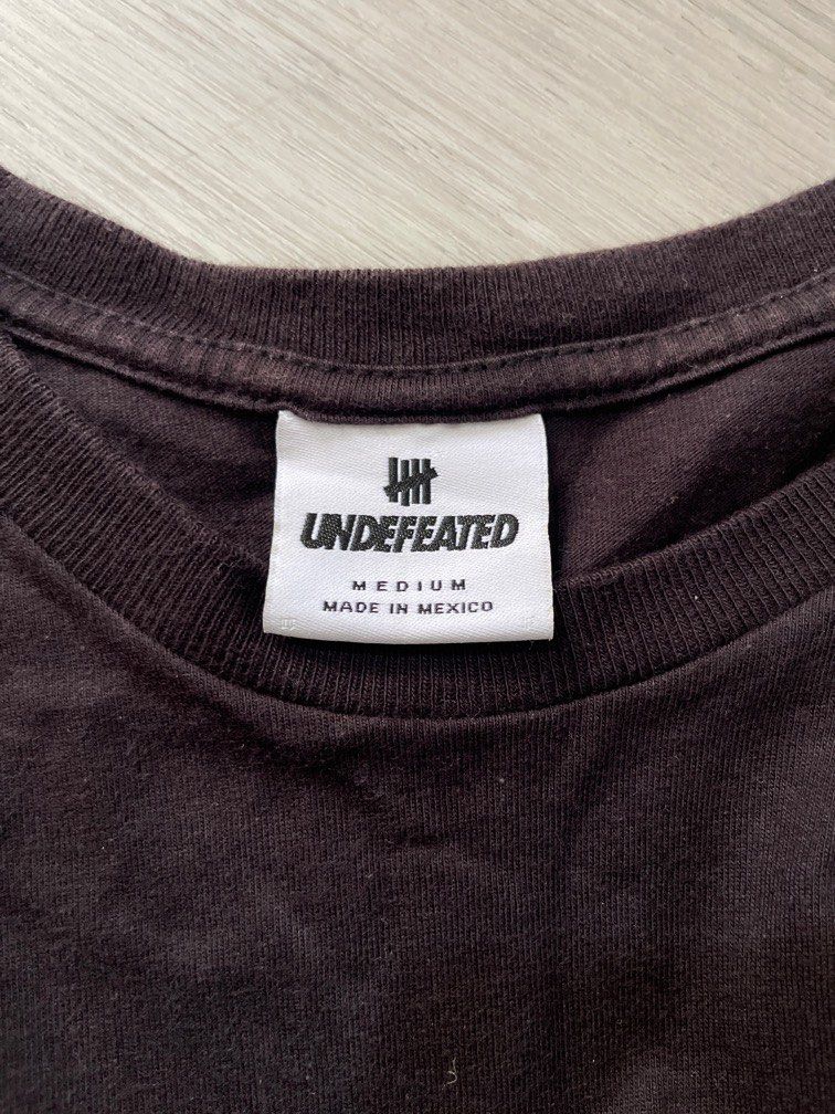 Undefeated (Category: Tshirts & Polo Shirts) located in Singapore. Submitted by mreus (Listing ID 1297272055, Image 3). Description: Authentic Undefeated Tee Size: M Colour: Black *Free normal mail or self pickup Measurements: Length 27” Pit to Pit 19” Shoulder 17.5”.