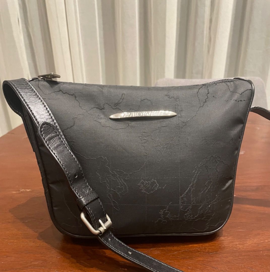 ALVIERRO MARTINI nylon sling bag (Category: Luxury Bags & Wallets) located in Davao. Submitted by mliza1020 (Listing ID 1297471229, Image 1). Description: Alviero Martini 1a classe nylon with leather sling bag. No flaws. Made in Italy Dimension: H 19 x L 24 x w 4.5 cm (approx).