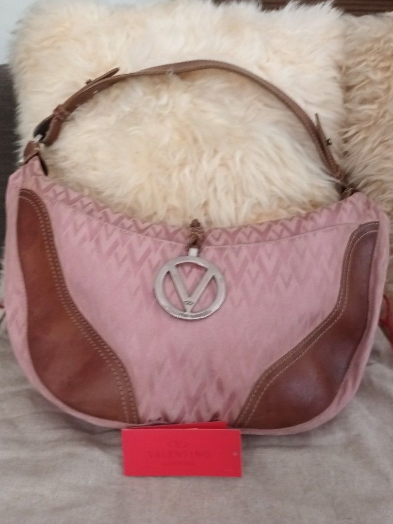 Authentic pink Valentino Garavani bag (Category: Luxury Bags & Wallets) located in Quezon City. Submitted by cncarousel (Listing ID 1297484499, Image 2). Description: 💯 Authentic not used just kept with dust bag card.