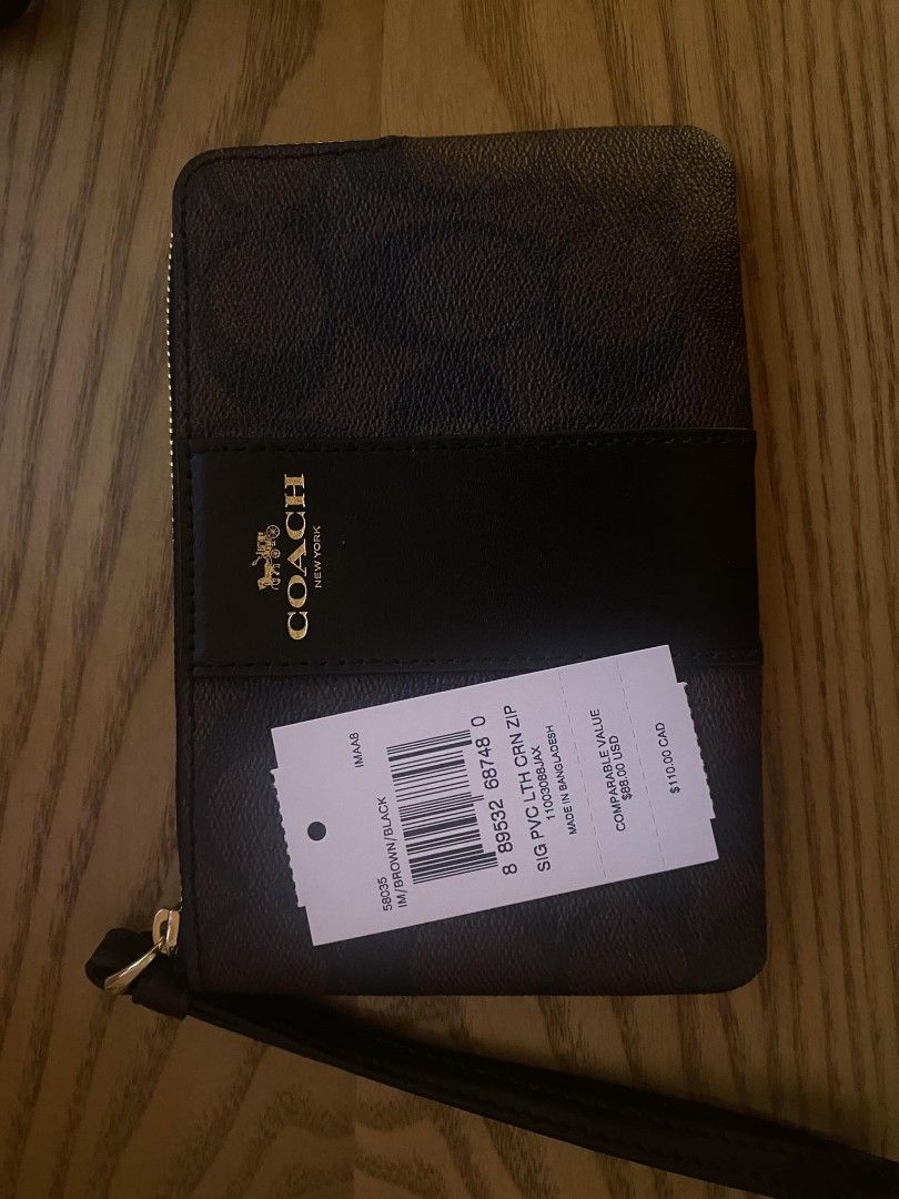 Coach Wristlet (Category: Wallets & Card holders) located in Quezon City. Submitted by dveee (Listing ID 1297438473, Image 1). Description: Coach wristlet monogram dark brown color brandnew from USA 2800.