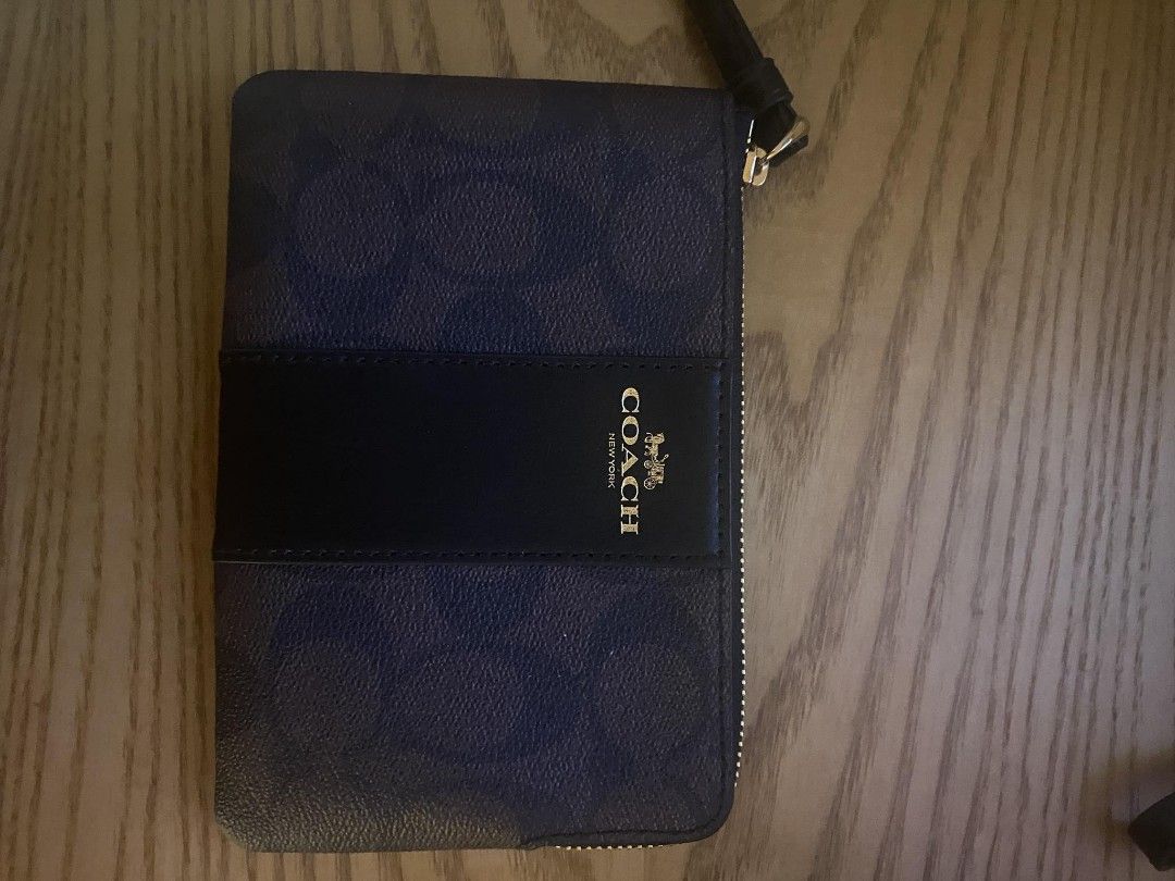Coach Wristlet (Category: Wallets & Card holders) located in Quezon City. Submitted by dveee (Listing ID 1297438473, Image 2). Description: Coach wristlet monogram dark brown color brandnew from USA 2800.