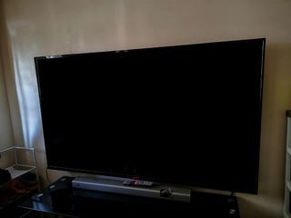 Flat screen TV with soundbar