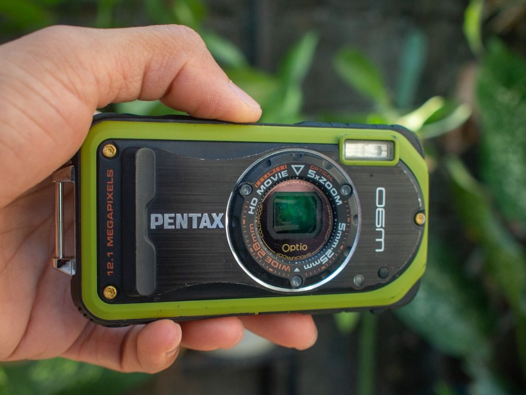 Pentax Optio W90 Digital Camera Digicam (Category: Cameras) located in Arayat. Submitted by josepdg (Listing ID 1297498067, Image 1). Description: 12.1MP CCD Digital Camera What's Included; -Camera with Strap -Battery (brand new) -32GB micro SD Card with Adapter -Universal Clip Charger *This is a used item so please expect some scratches, scuffs, and imperfections on the camera body. There are visible scratches on the display and some light scrat