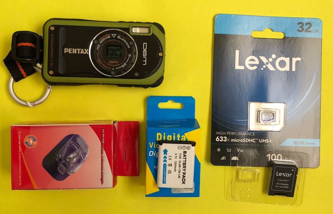 Pentax Optio W90 Digital Camera Digicam (Category: Cameras) located in Arayat. Submitted by josepdg (Listing ID 1297498067, Image 2). Description: 12.1MP CCD Digital Camera What's Included; -Camera with Strap -Battery (brand new) -32GB micro SD Card with Adapter -Universal Clip Charger *This is a used item so please expect some scratches, scuffs, and imperfections on the camera body. There are visible scratches on the display and some light scrat