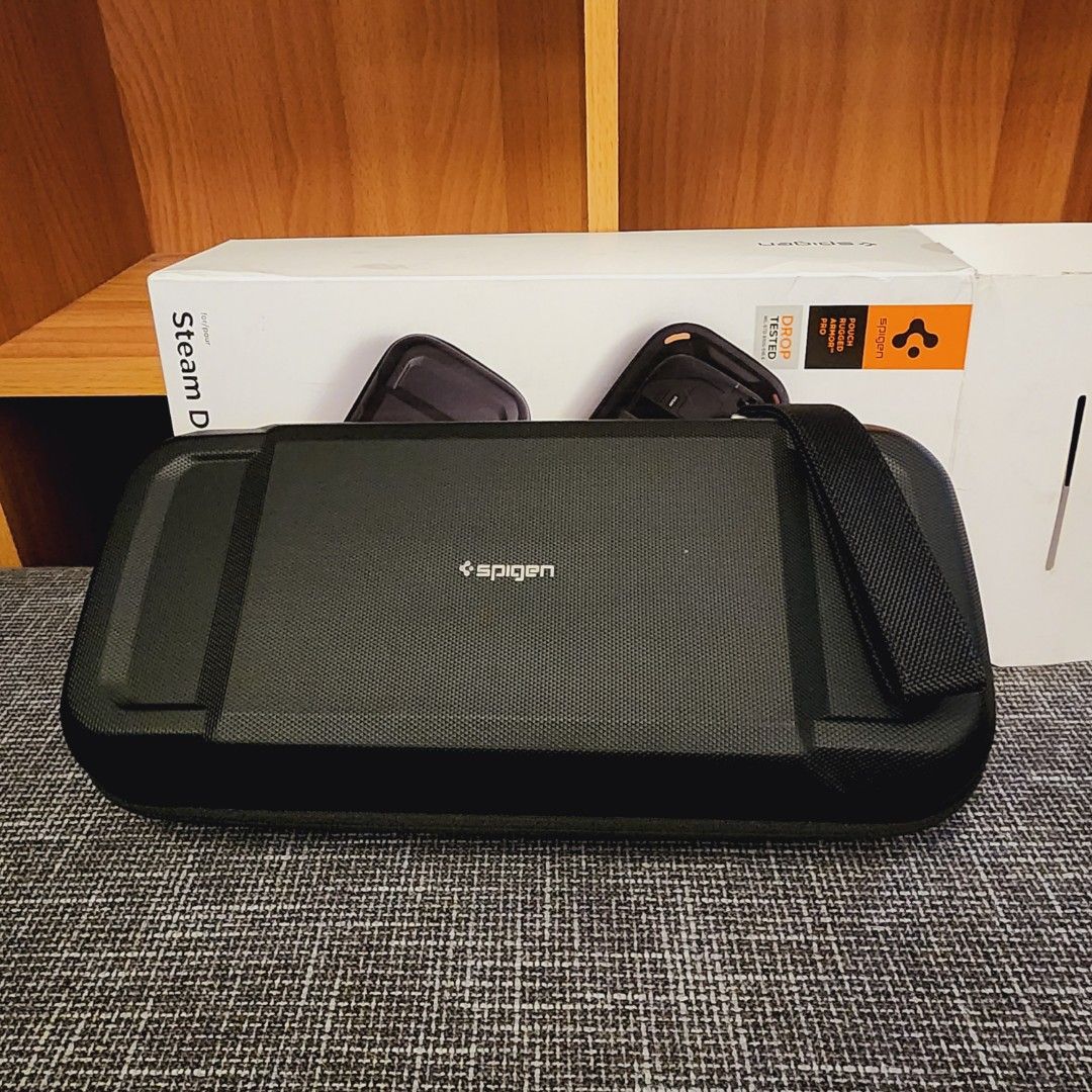 Spigen Rugged Armor Pro Pouch and Case for Steam Deck (Category: Others) located in Quezon City. Submitted by bubbles023 (Listing ID 1297522195, Image 2). Description: Spigen Rugged Armor Pro Pouch and Rugged Armor Case for Steam Deck Unused - figured it's too bulky for me just opened the box to test them, kept it in storage after selling both pouch and case Spigen Rugged Armor Pro Pouch details https://www.spigen.com/products/steam-deck-series-r