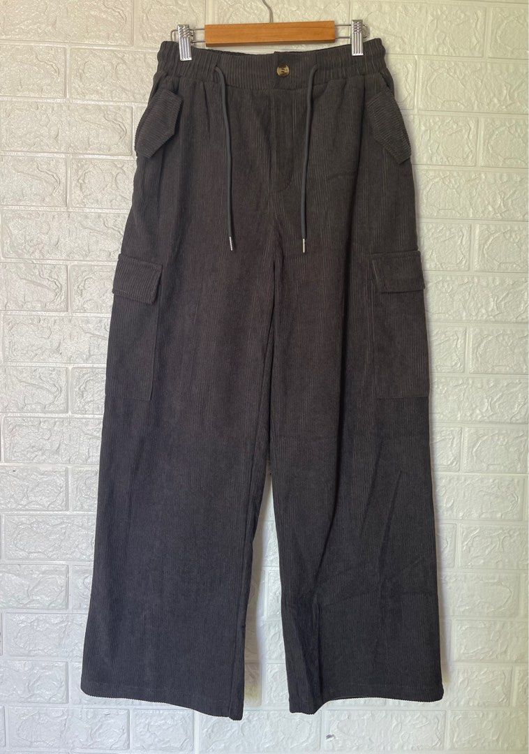 Gray corduroy wide leg pants (Category: Other Bottoms) located in Batangas. Submitted by declutter_harleth (Listing ID 1300956181, Image 2). Description: Good as new 28-32 waistline 38 full length Not faded (hirap lang mapic ng ayos) No when worn, thanks!.