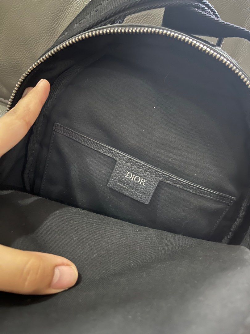 Dior sling backpack oblique canvas (Category: Luxury Bags & Wallets) located in Makati City. Submitted by cysarande (Listing ID 1300974453, Image 3). Description: 10/10 condition With cards Two way zip closure Adjustable straps SIZE AND FIT 8”W x 12”H x 4”D 2” handle drop 11-22” strap drop.