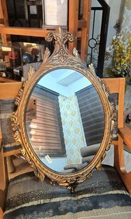 Italian vintage gilded metal hanging oval mirror