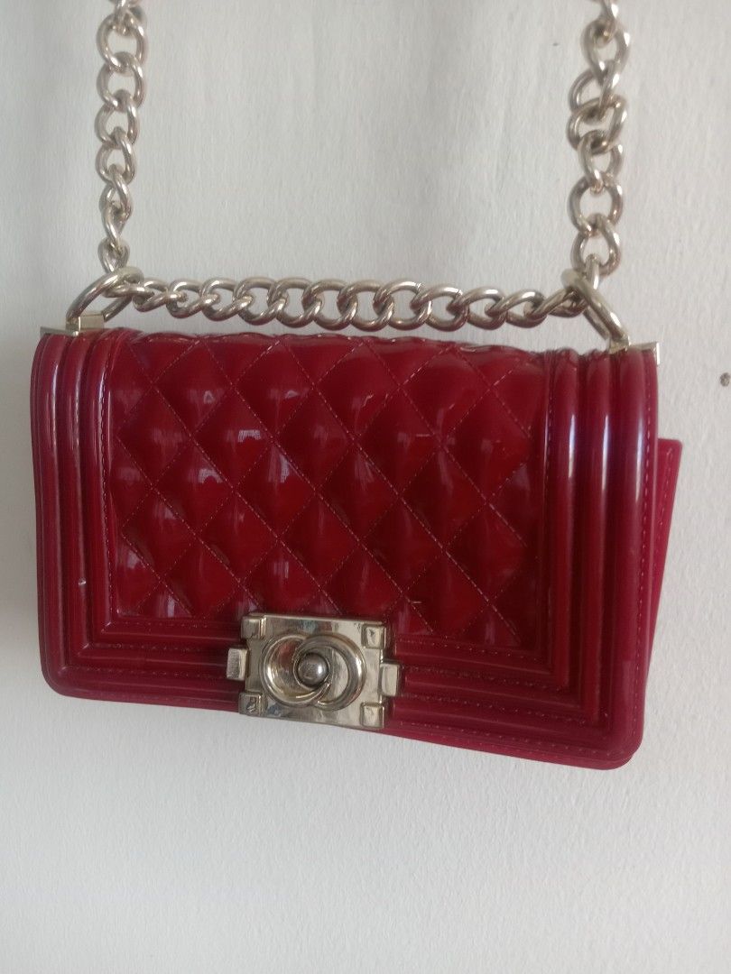 authentic Jelly Toyboy Chain Sling Bag Maroon (Category: Cross-body Bags) located in Quezon City. Submitted by ventaventa (Listing ID 1301136163, Image 2). Description: authentic frm hongkong like new color maroon a little scratch on logo area size 8x 5x3" 20x13x7.5cm super gandang pamporma.