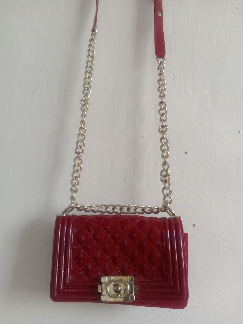 authentic Jelly Toyboy Chain Sling Bag Maroon (Category: Cross-body Bags) located in Quezon City. Submitted by ventaventa (Listing ID 1301136163, Image 3). Description: authentic frm hongkong like new color maroon a little scratch on logo area size 8x 5x3" 20x13x7.5cm super gandang pamporma.