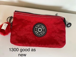 kipling pouch good as new red orginal sale 1000 onhand