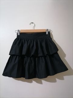 Layered black mini skirt with shorts lining