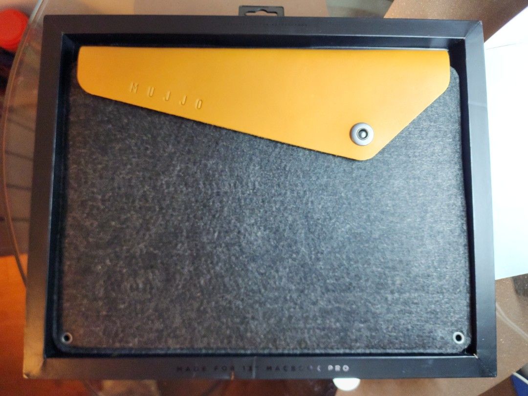 Mujjo MacBook Pro 13" sleeve (Category: Laptop Bags & Sleeves) located in Quezon City. Submitted by vintagespektroom (Listing ID 1301113562, Image 1). Description: For sale Mujjo Sleeve Brandnew For 13" MacBook Pro, 13" MacBook Air, iPad Pro 12.9 Crafted out of a unique combination of felt and vegetable-tanned leather, this sleeve has been designed to securely carry the all-new 13" MacBook Pro, 13" MacBook Air, iPad Pro 12.9. Praised by leading s