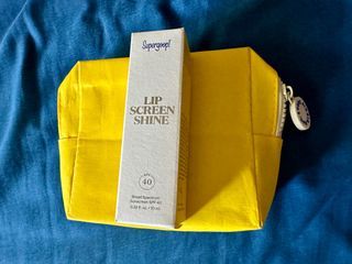 Supergoop! Lip screen shine 40spf with yellow pouch
