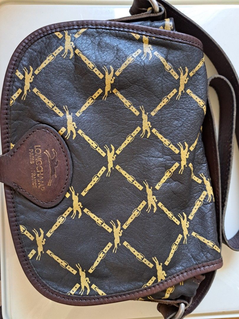 Vintage Longchamp Saddle Bag (Category: Luxury Bags & Wallets) located in Imus. Submitted by blessedbiz (Listing ID 1300999112, Image 1). Description: Authentic and rare Longchamp with 1980's Horse logo Napa Leather..Made in France Clean inside and out. Super minor rubs on leather. Normal signs usage of vintage bag.. Still useable :) RFS: Decluttering, in pursuit for a minimalist life.