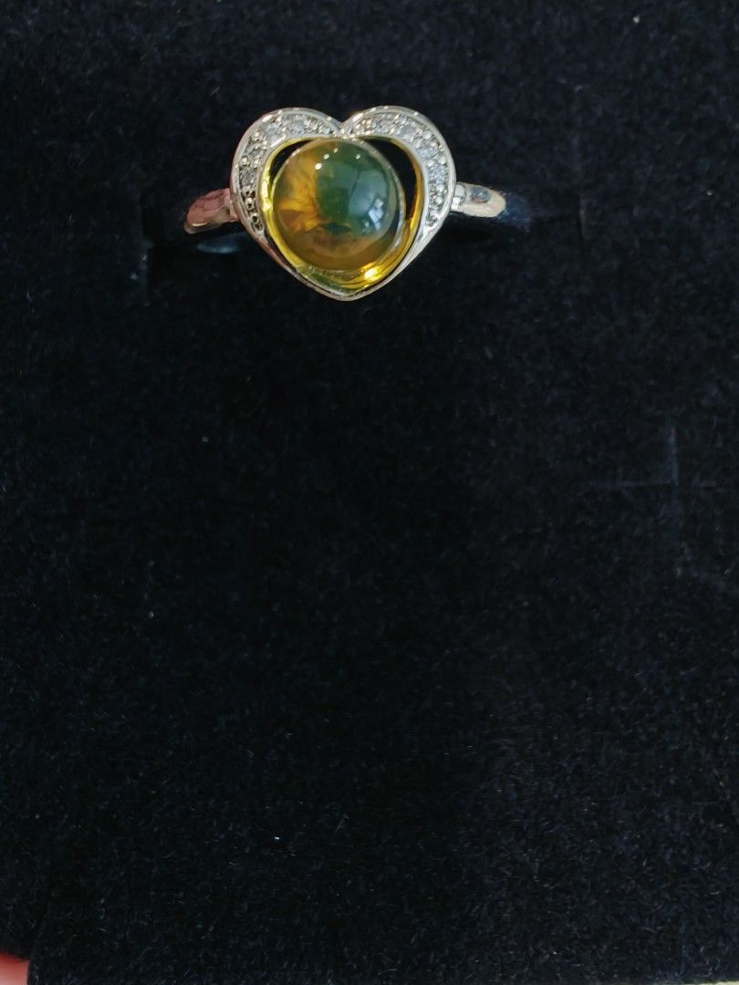 Amber ring (Category: Rings) located in Singapore. Submitted by kittynara (Listing ID 1302575199, Image 1). Description: Natural amber stone ring Authentic stones are more likely to have minor imperfections, like an uneven shape, dips in the surface, or pitting and some inclusions . not for fussy and difficult buyers ! with 925 adjustable ring size suitable as a mother's Day gift girlfriend or friendship gift come with a gift box able to send by 