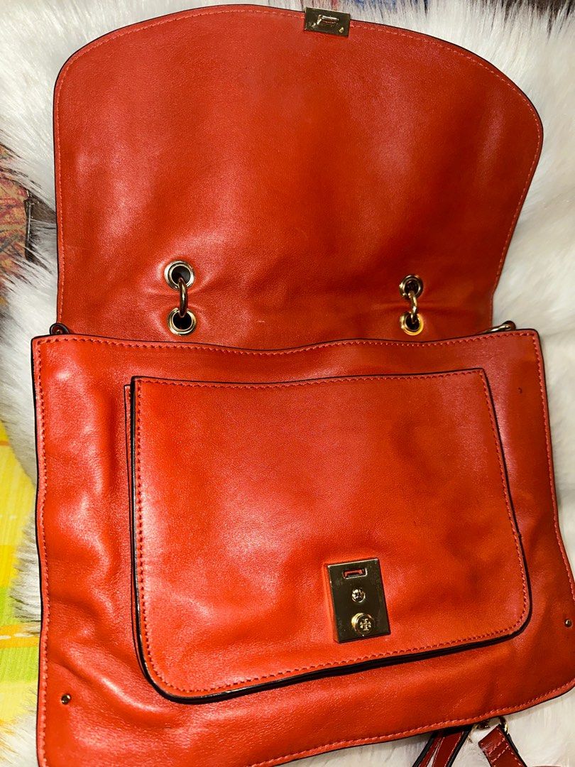 Authentic Vintage Tory Burch two way (Category: Luxury Bags & Wallets) located in Paranaque City. Submitted by love1927 (Listing ID 1302578612, Image 3). Description: Up for grabs is my TORY BURCH Vintage PRICELLA two way genuine leather bag,This is still in great pre-owned condition - some minor signs of wear on outside including nicks on the other side rubber lining on the right side,(kindly look at all pictures). Color: Tangerine Orange Descri
