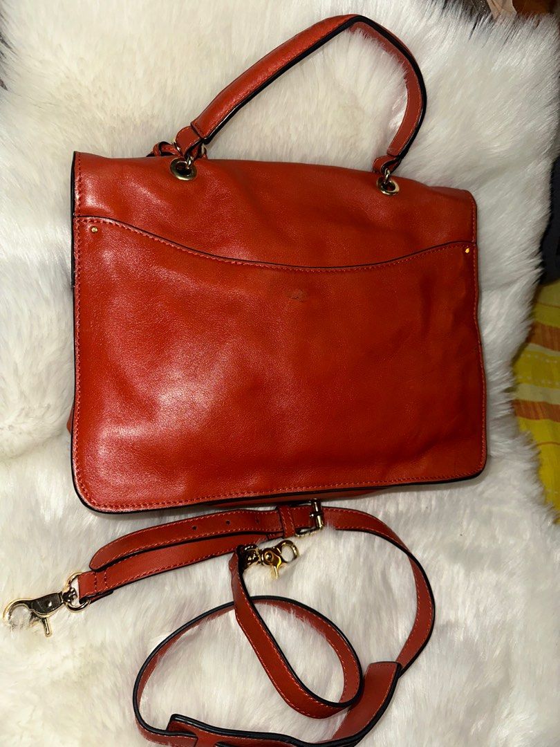 Authentic Vintage Tory Burch two way (Category: Luxury Bags & Wallets) located in Paranaque City. Submitted by love1927 (Listing ID 1302578612, Image 2). Description: Up for grabs is my TORY BURCH Vintage PRICELLA two way genuine leather bag,This is still in great pre-owned condition - some minor signs of wear on outside including nicks on the other side rubber lining on the right side,(kindly look at all pictures). Color: Tangerine Orange Descri