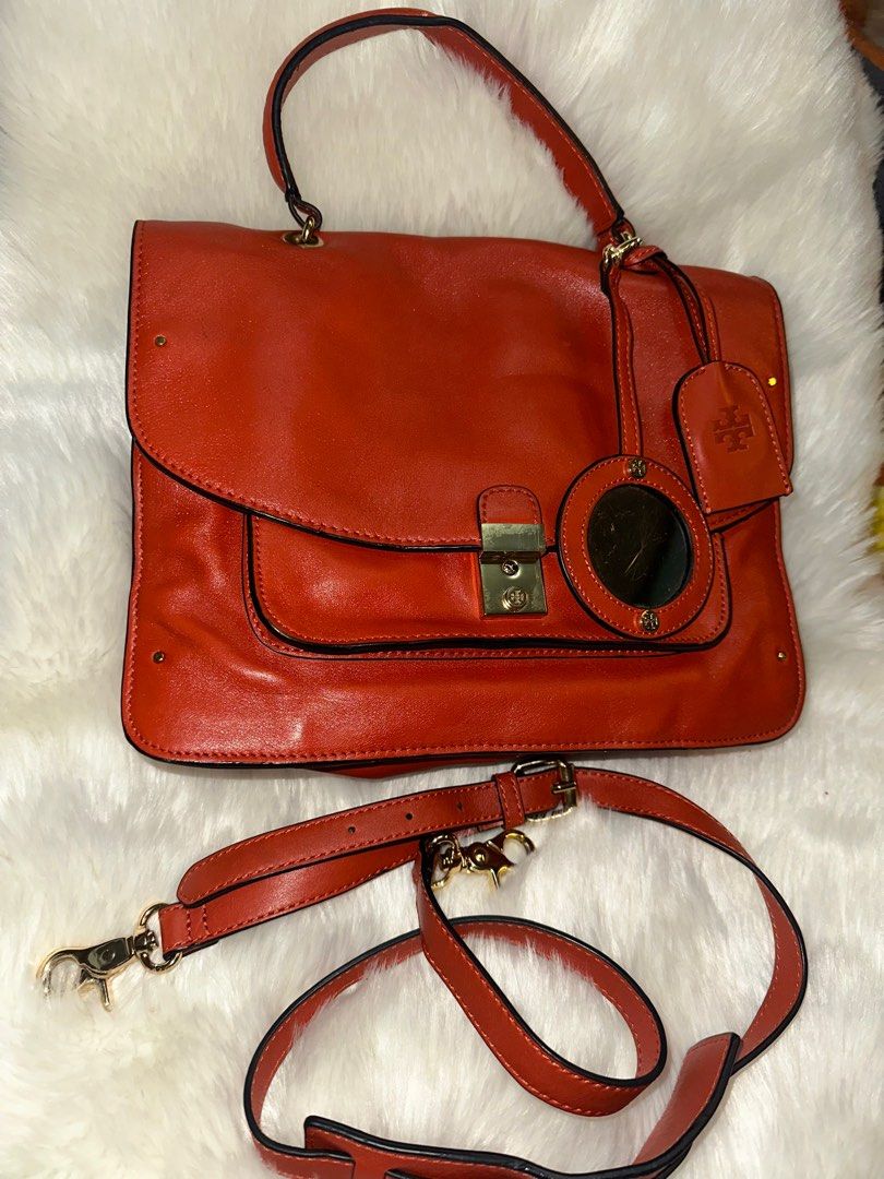 Authentic Vintage Tory Burch two way (Category: Luxury Bags & Wallets) located in Paranaque City. Submitted by love1927 (Listing ID 1302578612, Image 1). Description: Up for grabs is my TORY BURCH Vintage PRICELLA two way genuine leather bag,This is still in great pre-owned condition - some minor signs of wear on outside including nicks on the other side rubber lining on the right side,(kindly look at all pictures). Color: Tangerine Orange Descri