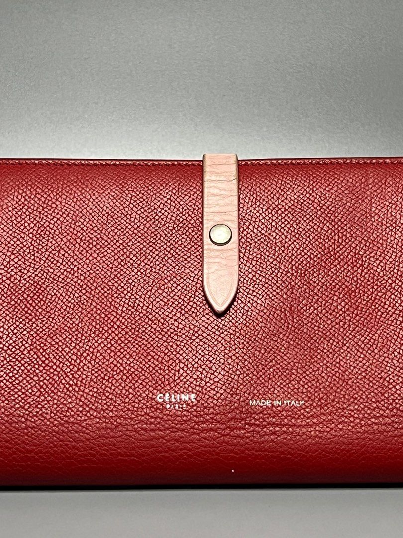 Celine Large Leather Wallet (Category: Luxury Bags & Wallets) located in Manila. Submitted by zapantaesther (Listing ID 1302698448, Image 2). Description: Celine Leather Wallet Large Red/Pink Color Signs of Use on leather strap Minor rubs on corners .