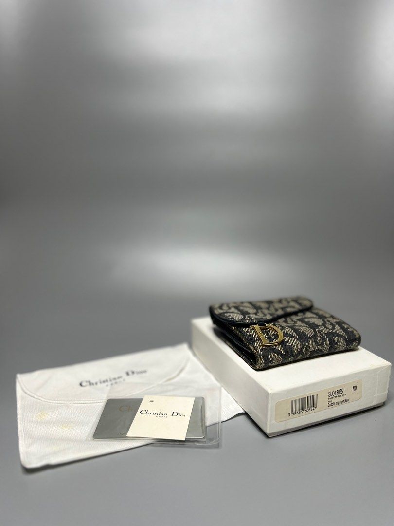 Christian Dior Saddle Short Wallet (Category: Luxury Bags & Wallets) located in Manila. Submitted by zapantaesther (Listing ID 1302695565, Image 1). Description: Christian Dior Saddle Short Wallet In excellent condition with box, dustbag and cards Issue: Signs of use, dirt.
