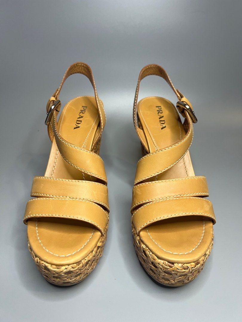 Prada Wedge Sandals (Category: Wedges) located in Manila. Submitted by zapantaesther (Listing ID 1302692828, Image 1). Description: Authentic Prada Wedge Issue: Signs of use on heel see photos for reference Still in very good condition No inclusion, provided box only.