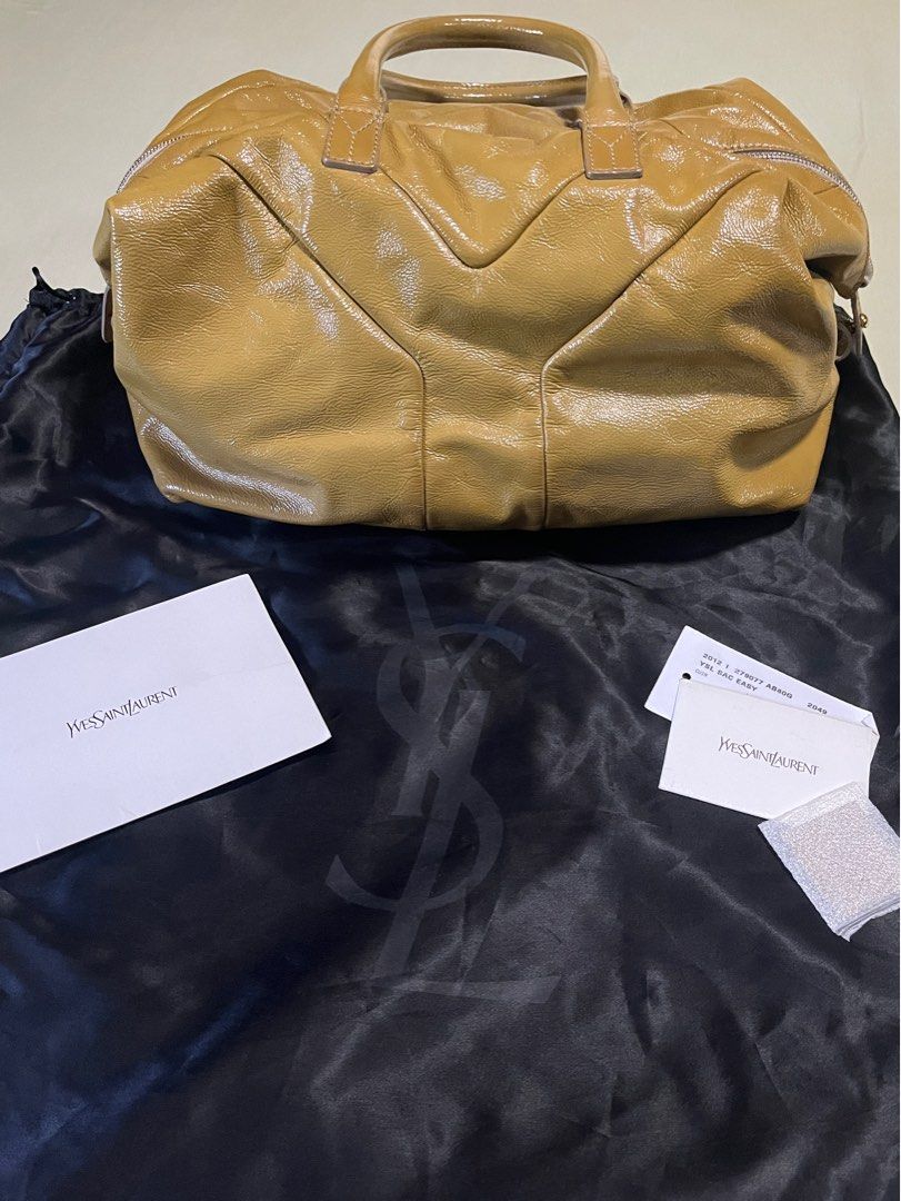 YSL Easy Patent Leather (Category: Luxury Bags & Wallets) located in Paranaque City. Submitted by karpalun (Listing ID 1302656655, Image 2). Description: Mustard / Khaki Length 37cm, Width 16cm, Height 22cm With dust bag and cards.