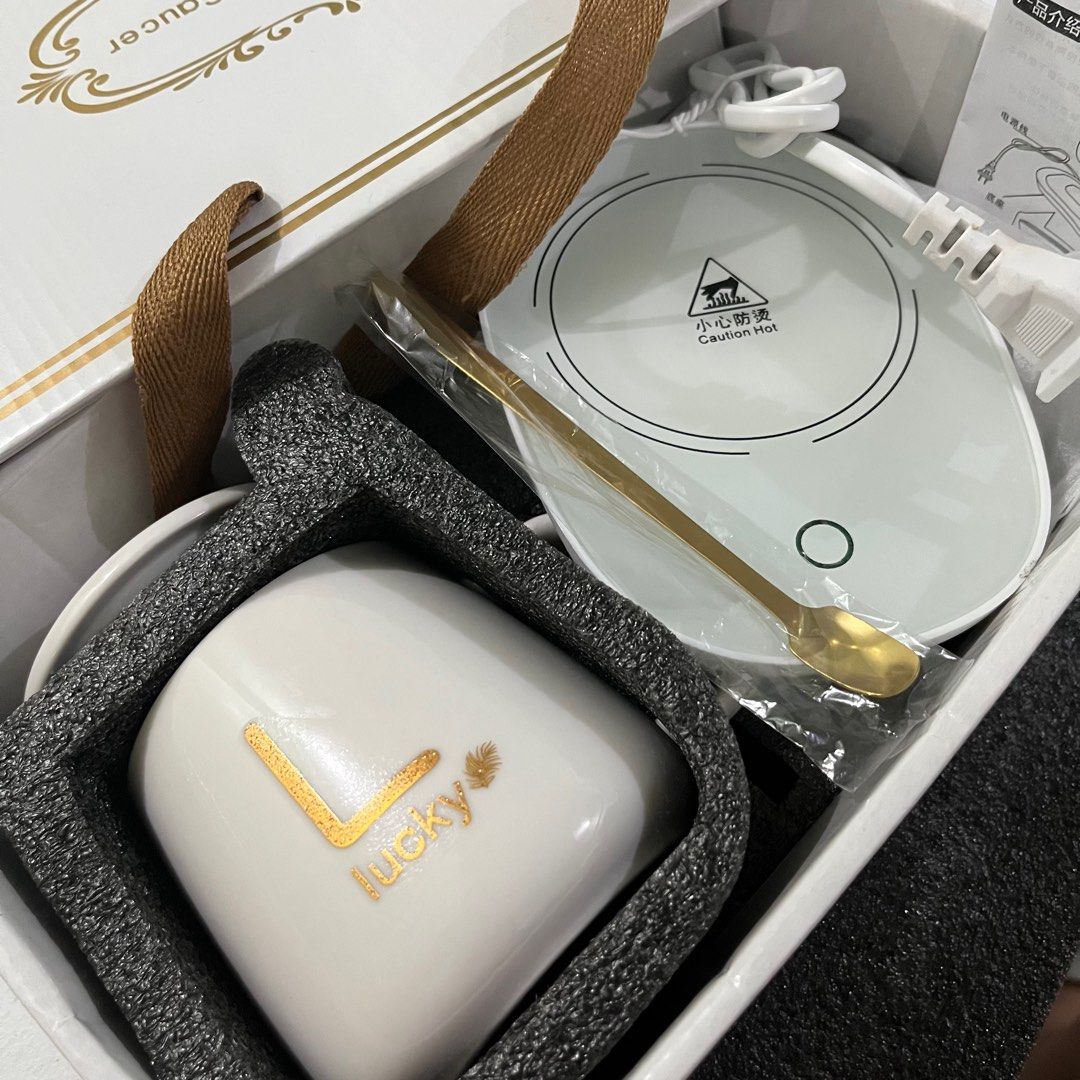 Ceramic Mug Set (Category: Coffee & Tea Tableware) located in Manila. Submitted by decluttify (Listing ID 1302773666, Image 1). Description: Ceramic mug with lid (400ml/ 16 watts) Stainless spoon Electric coaster with plug with manual and gift box.
