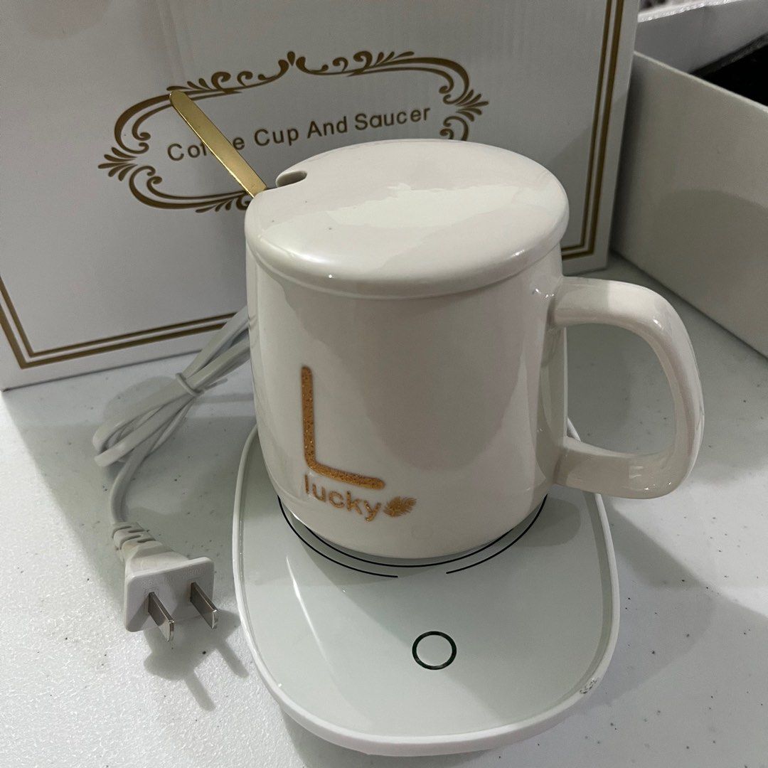 Ceramic Mug Set (Category: Coffee & Tea Tableware) located in Manila. Submitted by decluttify (Listing ID 1302773666, Image 2). Description: Ceramic mug with lid (400ml/ 16 watts) Stainless spoon Electric coaster with plug with manual and gift box.