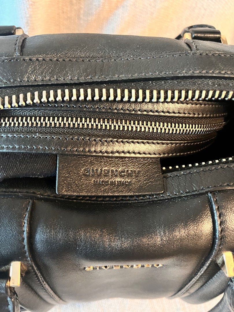 Givenchy authentic Lucrezia medium black leather (Category: Luxury Bags & Wallets) located in Makati City. Submitted by loveeph (Listing ID 1302823428, Image 3). Description: Moving out sale! Selling from personal collection Givenchy Lucrezia bag in medium Duffle bag shape and large interior compartment, great for travel and errands. With two top handles and a crossbody strap. Inside has a large zippered pocket and cell phone slots. Black cow lea