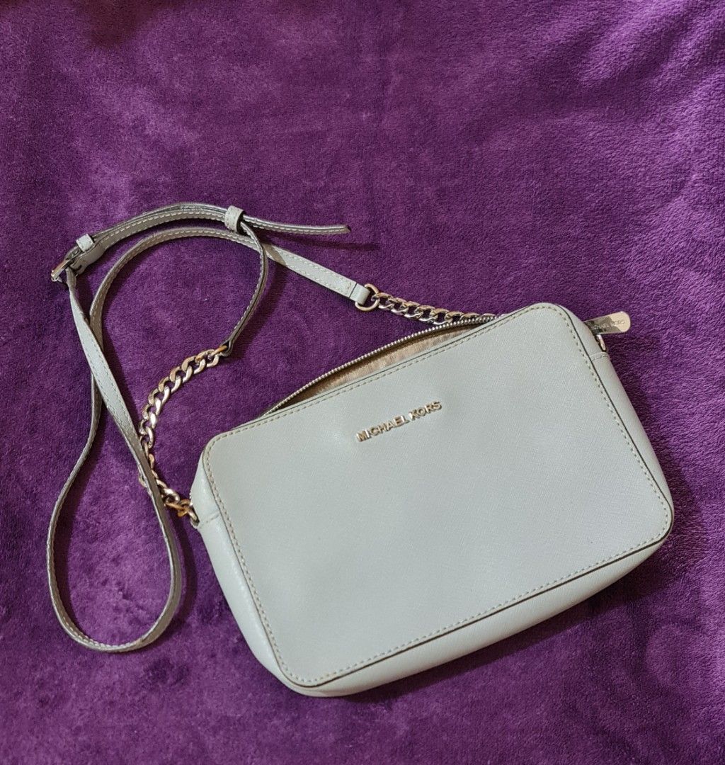 MK Michael Kors bag preloved from SG (Category: Shoulder Bags) located in Tarlac. Submitted by depplove (Listing ID 1302797024, Image 1). Description: My preloved MK bag from Singapore. Silver faded. Usable. Check photoes. Zipper smooth..