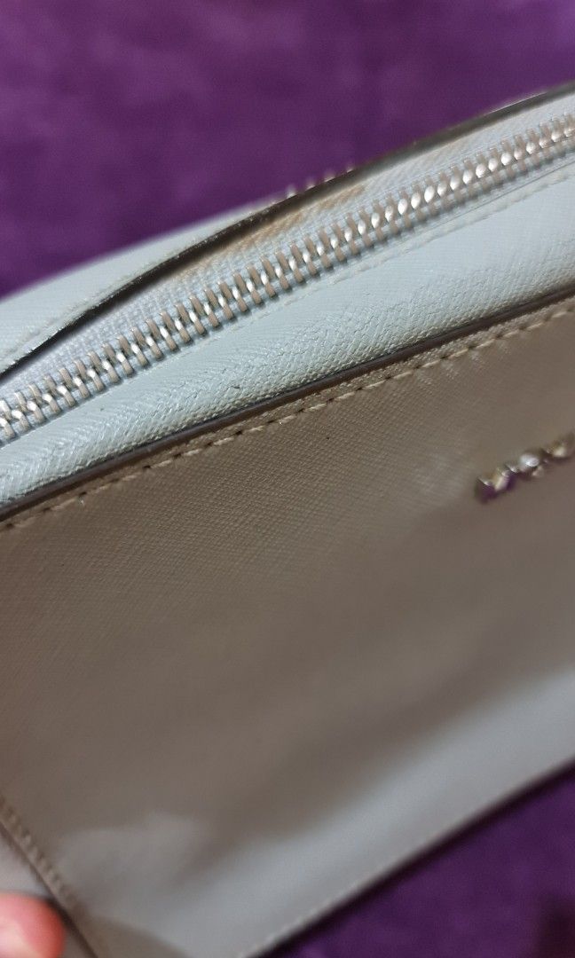 MK Michael Kors bag preloved from SG (Category: Shoulder Bags) located in Tarlac. Submitted by depplove (Listing ID 1302797024, Image 3). Description: My preloved MK bag from Singapore. Silver faded. Usable. Check photoes. Zipper smooth..