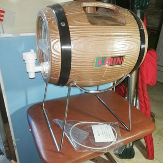A barrel shaped storage pitcher