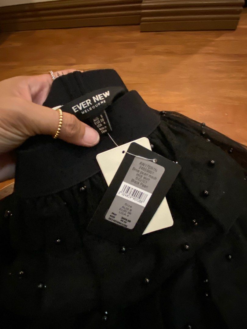 Ever New Skirt with embellishments (Category: Skirts) located in Las Pinas. Submitted by mimachay (Listing ID 1303035279, Image 2). Description: Brand new Ever New Shirt. Black skirt with embellishments, never worn and still with tag. EUR size 36. Garterize. Can be used for evening parties. .