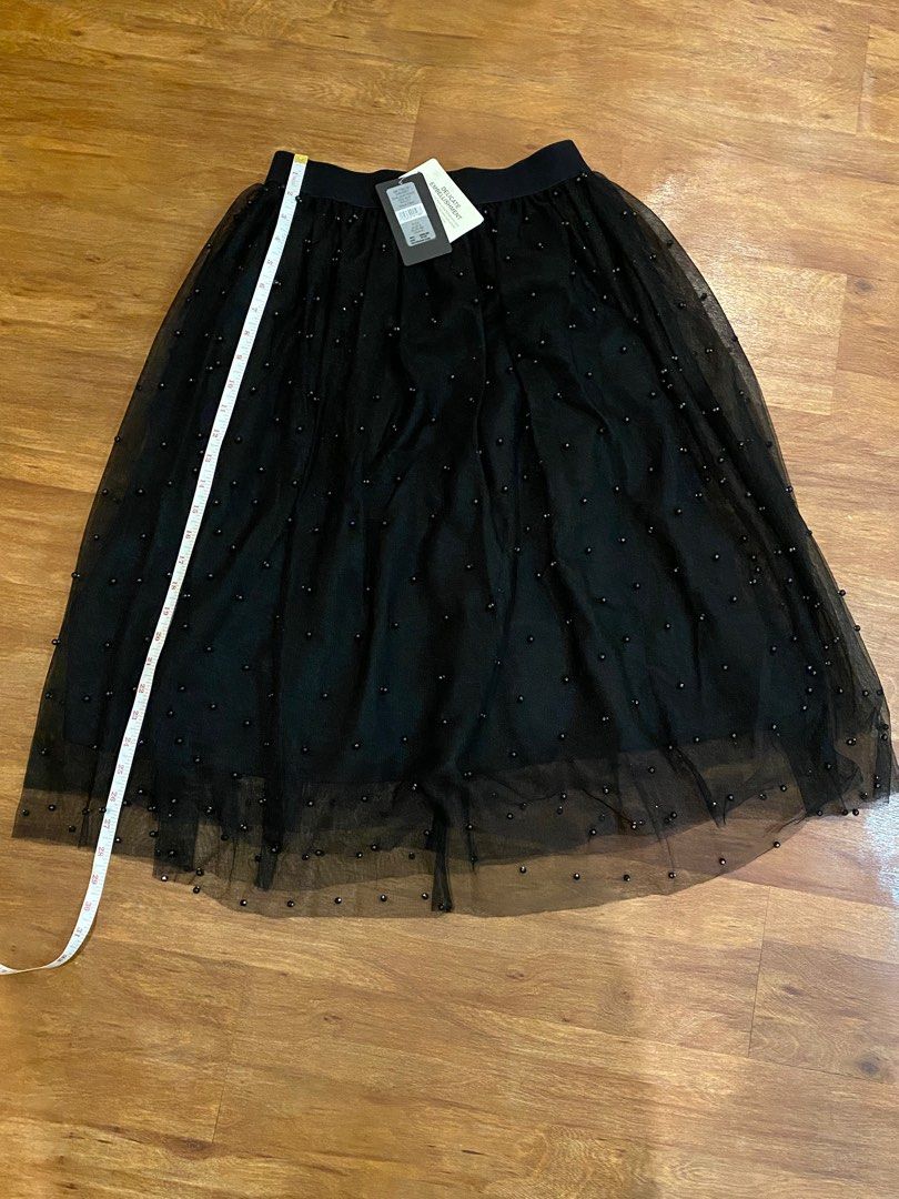 Ever New Skirt with embellishments (Category: Skirts) located in Las Pinas. Submitted by mimachay (Listing ID 1303035279, Image 1). Description: Brand new Ever New Shirt. Black skirt with embellishments, never worn and still with tag. EUR size 36. Garterize. Can be used for evening parties. .