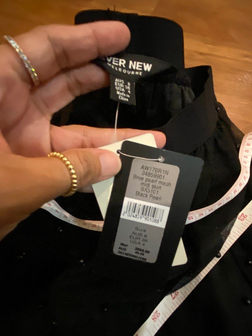 Ever New Skirt with embellishments (Category: Skirts) located in Las Pinas. Submitted by mimachay (Listing ID 1303035279, Image 3). Description: Brand new Ever New Shirt. Black skirt with embellishments, never worn and still with tag. EUR size 36. Garterize. Can be used for evening parties. .