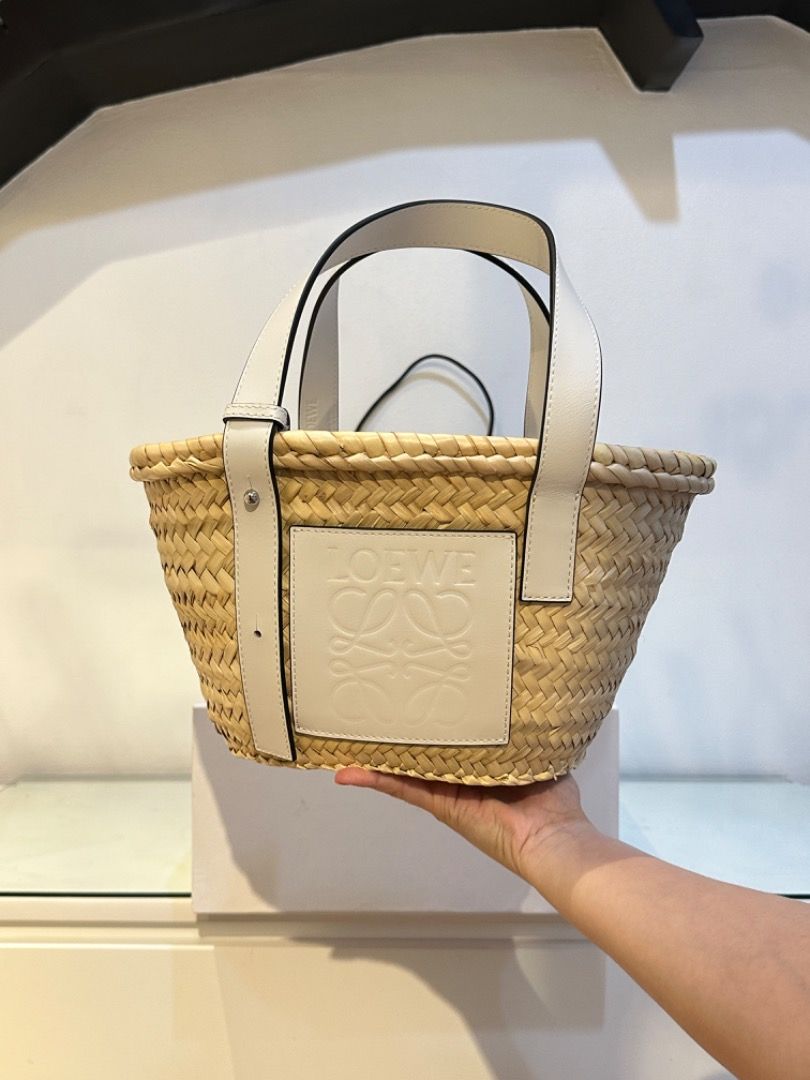 Loewe Basket Bag Raffia Tote (Category: Luxury Bags & Wallets) located in Manila. Submitted by designerarchives.ph (Listing ID 1303071624, Image 2). Description: Size: Small Color: White Perfect bag for summer 🌞🌴 Dimensions: 33 x 17 x 13cm Onhand is SOLD already. Preorder available 10 days! Complete inclusions and packaging! Can send photo of the RECEIPT. Actual detailed photos are already uploaded (won’t entertain asking for more photos) Buyer