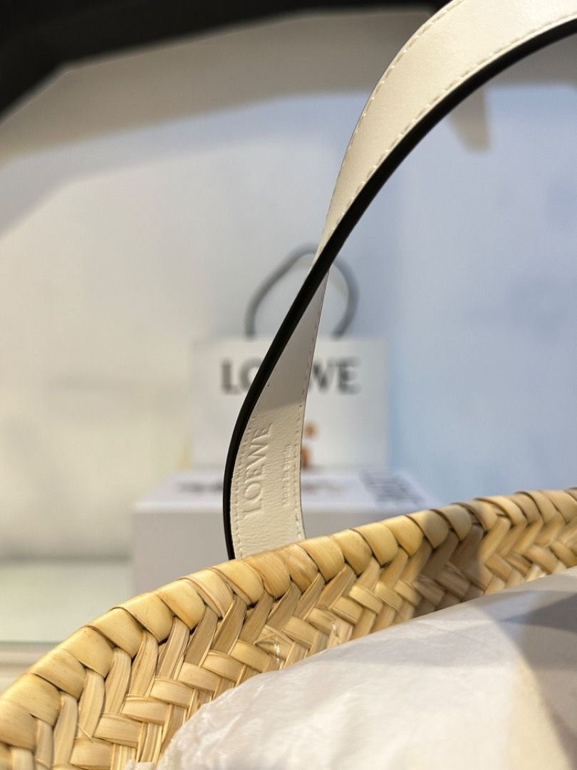 Loewe Basket Bag Raffia Tote (Category: Luxury Bags & Wallets) located in Manila. Submitted by designerarchives.ph (Listing ID 1303071624, Image 3). Description: Size: Small Color: White Perfect bag for summer 🌞🌴 Dimensions: 33 x 17 x 13cm Onhand is SOLD already. Preorder available 10 days! Complete inclusions and packaging! Can send photo of the RECEIPT. Actual detailed photos are already uploaded (won’t entertain asking for more photos) Buyer