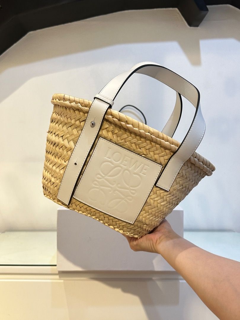Loewe Basket Bag Raffia Tote (Category: Luxury Bags & Wallets) located in Manila. Submitted by designerarchives.ph (Listing ID 1303071624, Image 1). Description: Size: Small Color: White Perfect bag for summer 🌞🌴 Dimensions: 33 x 17 x 13cm Onhand is SOLD already. Preorder available 10 days! Complete inclusions and packaging! Can send photo of the RECEIPT. Actual detailed photos are already uploaded (won’t entertain asking for more photos) Buyer
