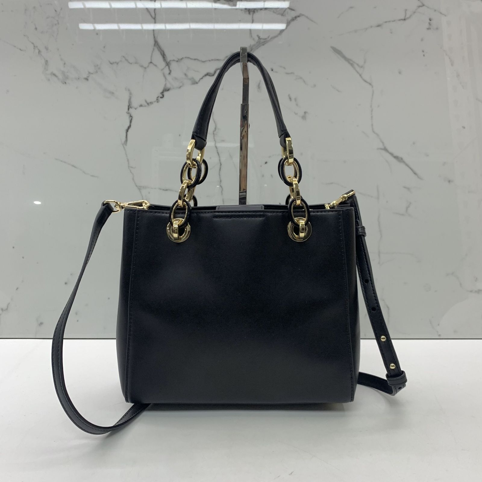 Michael kors black flower bag discount