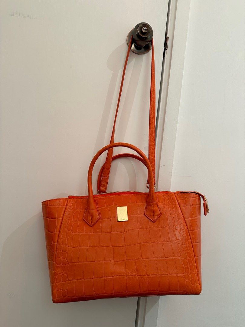 Orange leather handbags and purses shop