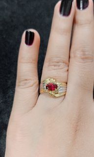 Japan 18k gold ring (combination of yellow and white gold/ 2 tone) with ruby on the center and dias on both side