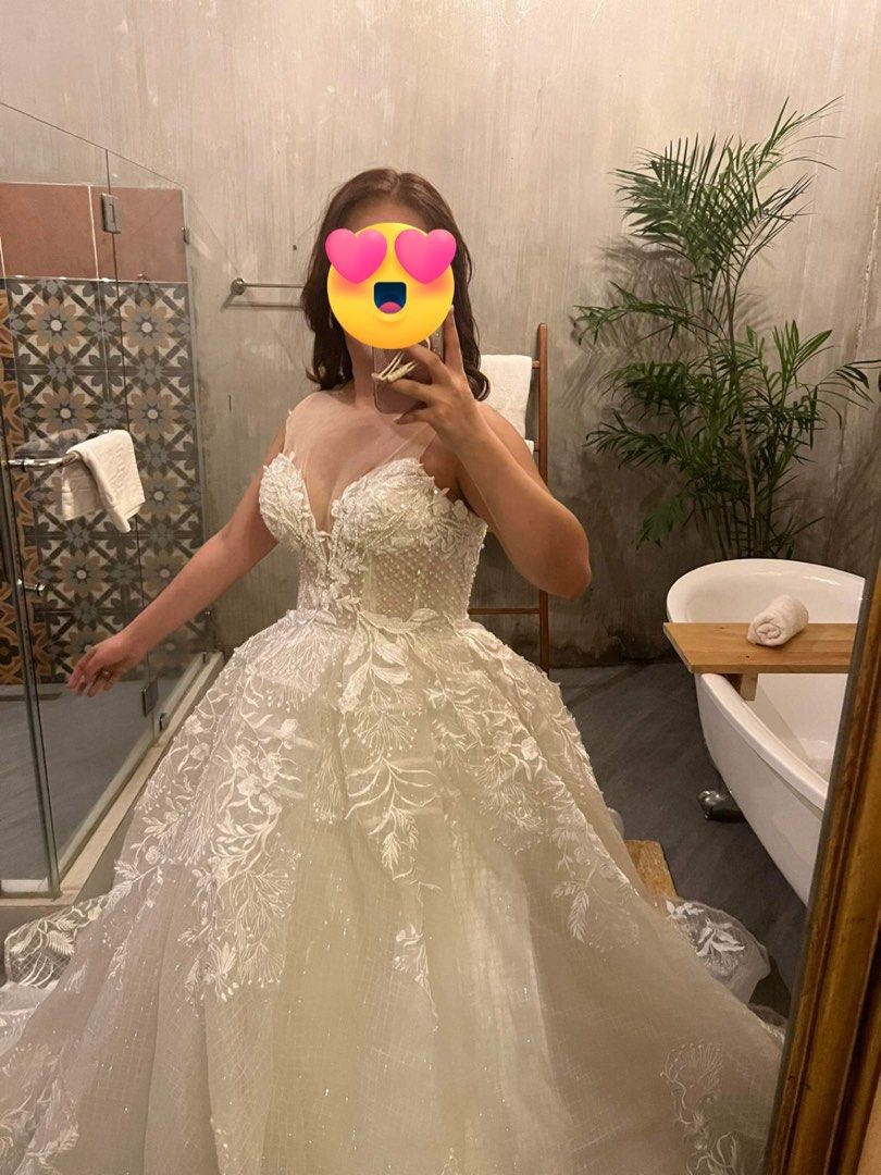 Wedding gown-princess ball gown (Category: Evening dresses & gowns) located in San Fernando. Submitted by declutteringmd.05 (Listing ID 1303203014, Image 3). Description: Bridal gown (Ball gown type) - Corset-type beaded top - Ball gown with layers of silk, tulle and jusi-type outer layer - Long trail approximately 2-3meters - used as a reception gown during our wedding - fits small to semi-large frame (with adjustable back straps) - See through 