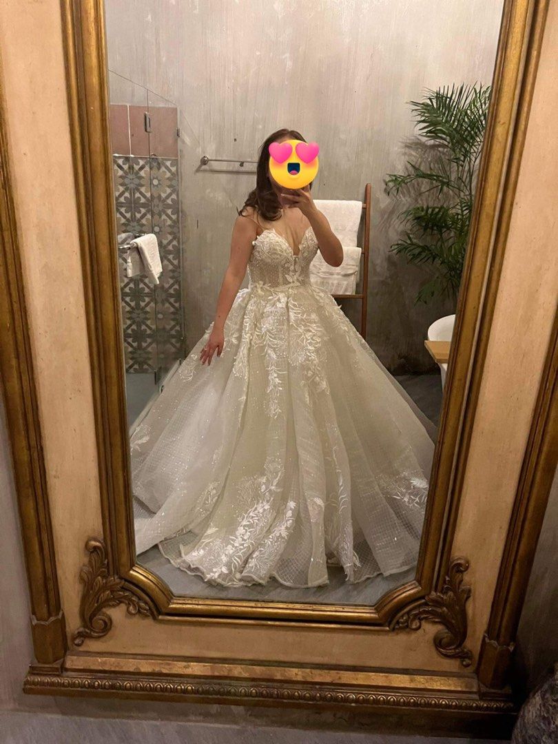 Wedding gown-princess ball gown (Category: Evening dresses & gowns) located in San Fernando. Submitted by declutteringmd.05 (Listing ID 1303203014, Image 2). Description: Bridal gown (Ball gown type) - Corset-type beaded top - Ball gown with layers of silk, tulle and jusi-type outer layer - Long trail approximately 2-3meters - used as a reception gown during our wedding - fits small to semi-large frame (with adjustable back straps) - See through 