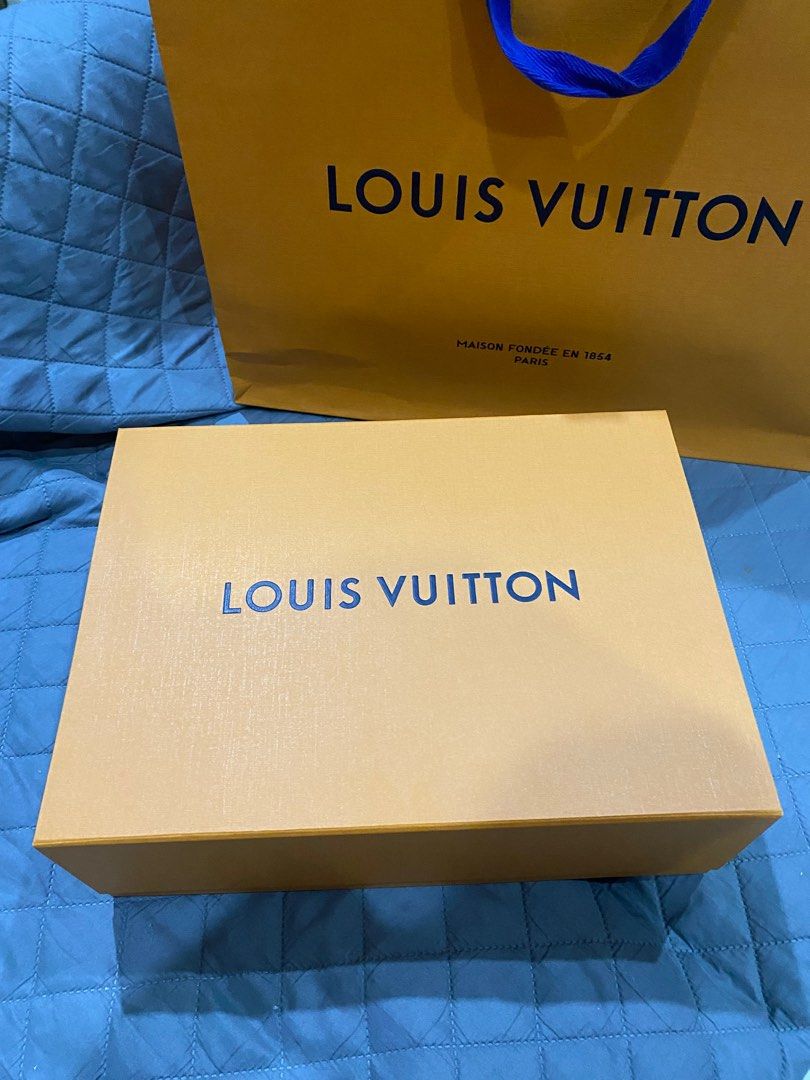 AUTH LV BOX (25x35x12 CM) & PAPERBAG SET (Category: Luxury Bags & Wallets) located in Las Pinas. Submitted by cc.decluttering (Listing ID 1303396436, Image 1). Description: Box: 25 cm x 30 x 12 cm + paperbag BRAND NEW NO FLAW MOP: Gcash MOD: Grab/lalamove/J&T (for small items) - buyer will shoulder delivery fee .