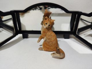 mouse on cat's tail figurine