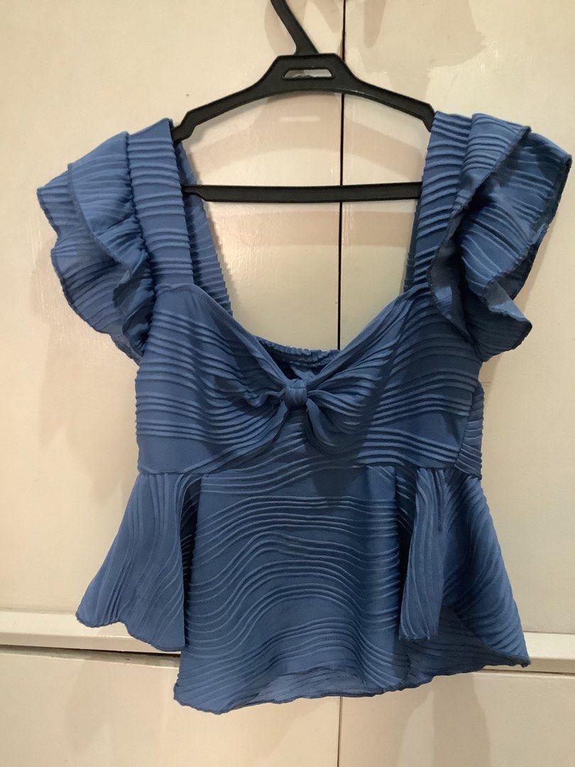 Powder blue peplum baby top (Category: Blouses) located in Quezon City. Submitted by ayowmie (Listing ID 1303352999, Image 1). Description: Used once! RFS: decluttering Size: small fits medium mop: gcash mod: lalamove.